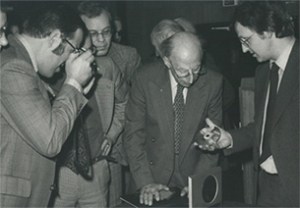 Elderly Dutch men in the late 70s marvel at the CD prototype